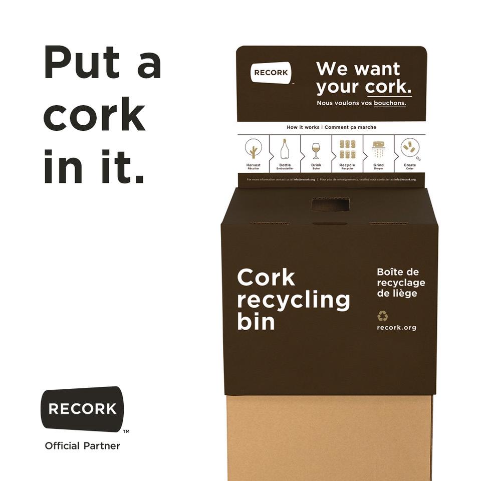 Display of a cork recycling kiosk with the text: Put a cork in it.