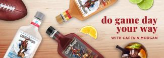 Assorted bottles of Captain Morgan rum on a table with a football. Text:Do Game Day Your Way with Captain Morgan